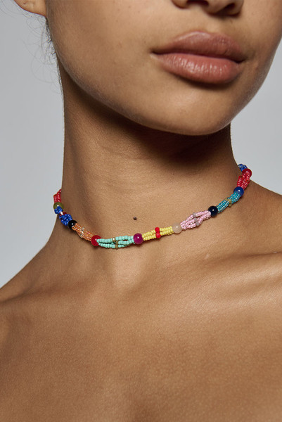 Hand beaded in a twisted multi-colour design, this artisanal choker sits close at the neck at forty centimetres. It is what finishes a plain linen dress for dinner. One size.