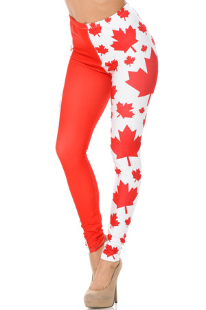 Our Creamy Soft Canadian Flag Plus Size Leggings feature a cool vertical design with solid red panels and red maple leaf print on a white background panels.