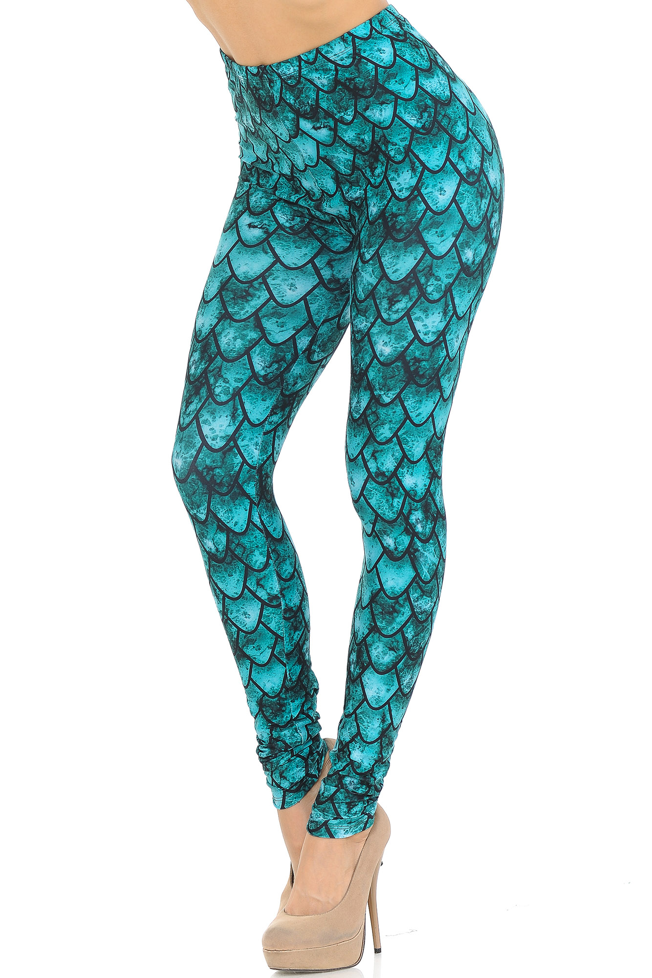 Left side right knee bent view of our Creamy Soft Green Scale Leggings - USA Fashion™ with an all over scale design that will transform you into a different creature such as a mermaid or dragon, ideal for Hallowen and fun stand out looks.