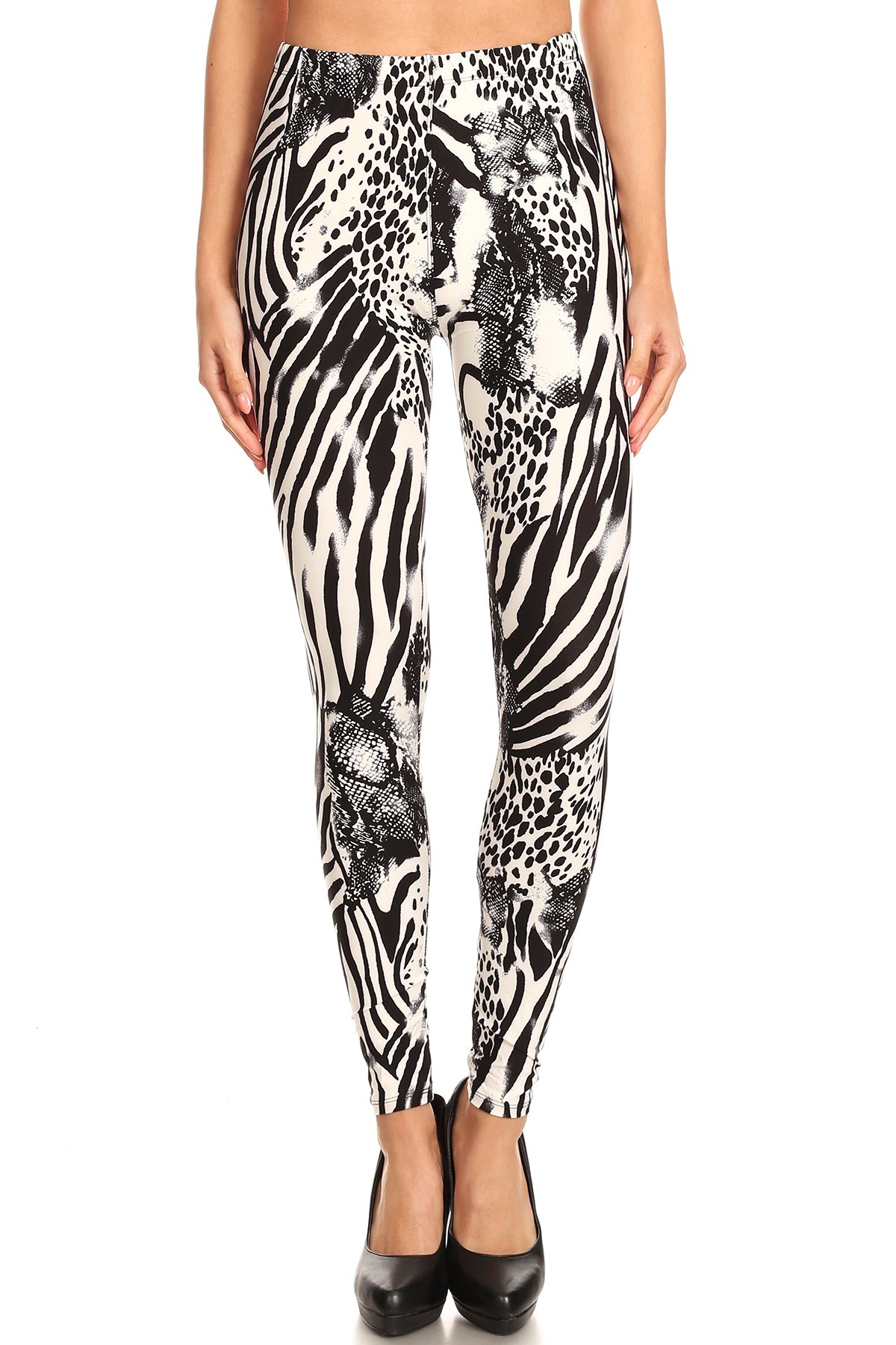 Our black and white colored Buttery Smooth Wild Safari Leggings feature a mixed animal print design of zebra stripes, cheetah spots, and reptile scales.