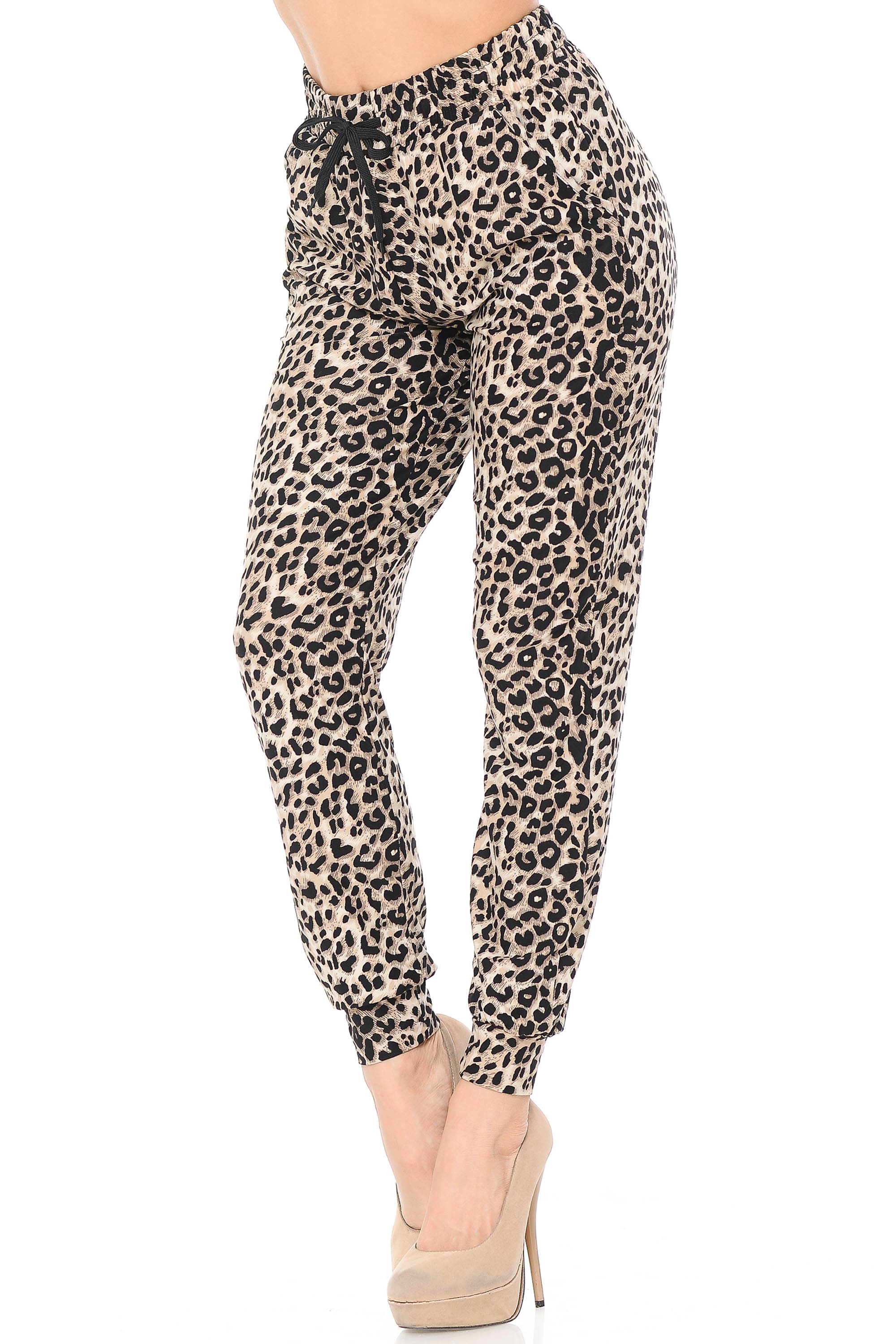 Partial front view of Buttery Soft Feral Cheetah Joggers with a tie string and elastic waist.