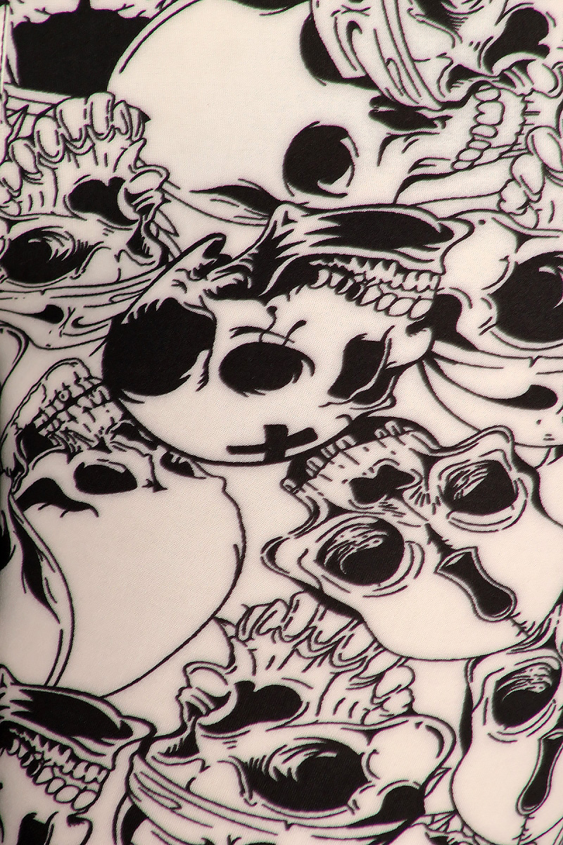 Close-up fabric image of Buttery Smooth White Layers of Skulls Plus Size Leggings - 3X-5X