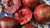 Fresh plums and a glass of port wine on rustic wooden board