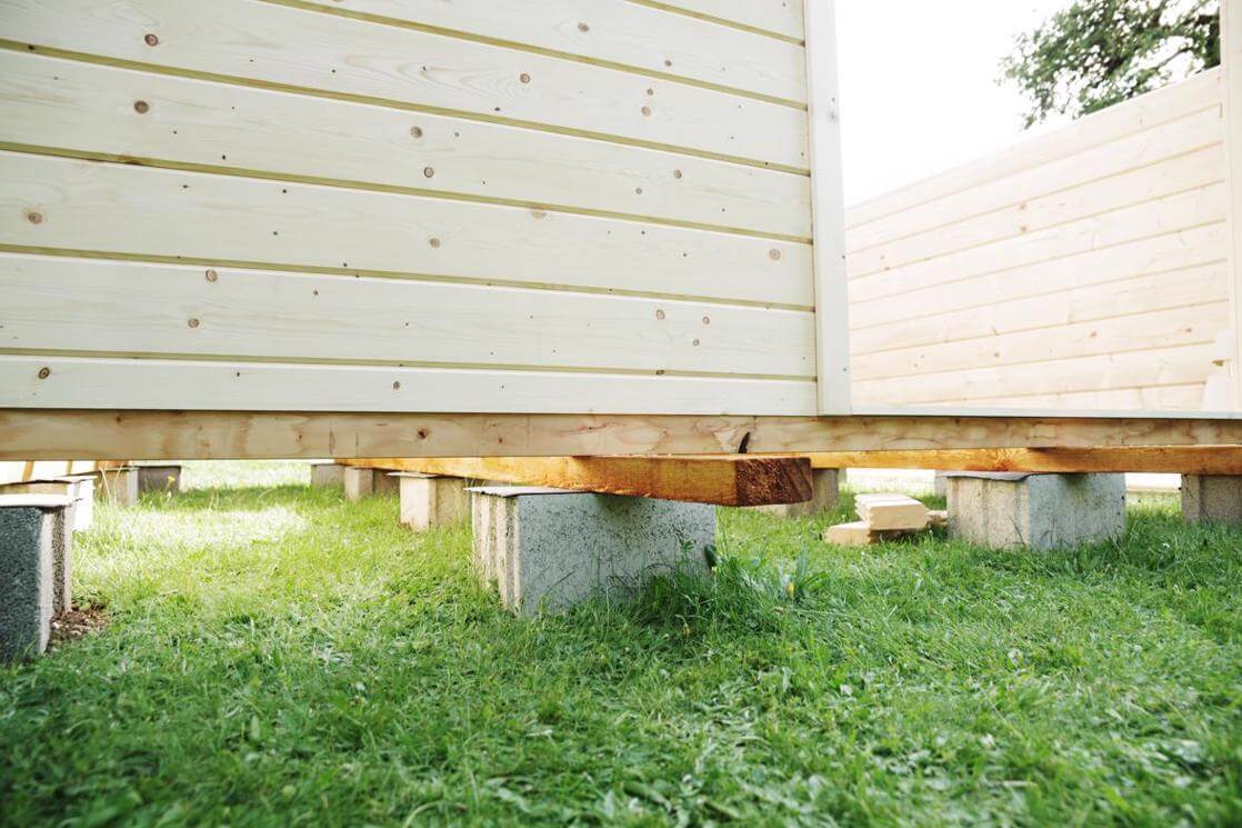 Skid foundation on concrete blocks under a shed