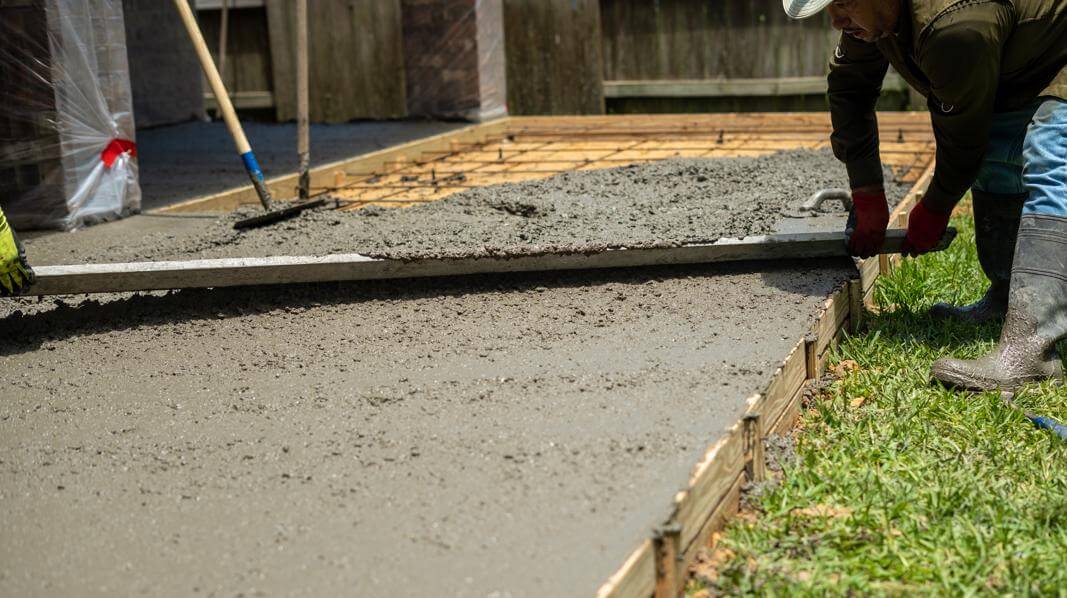 Poured concrete slab foundation for a shed