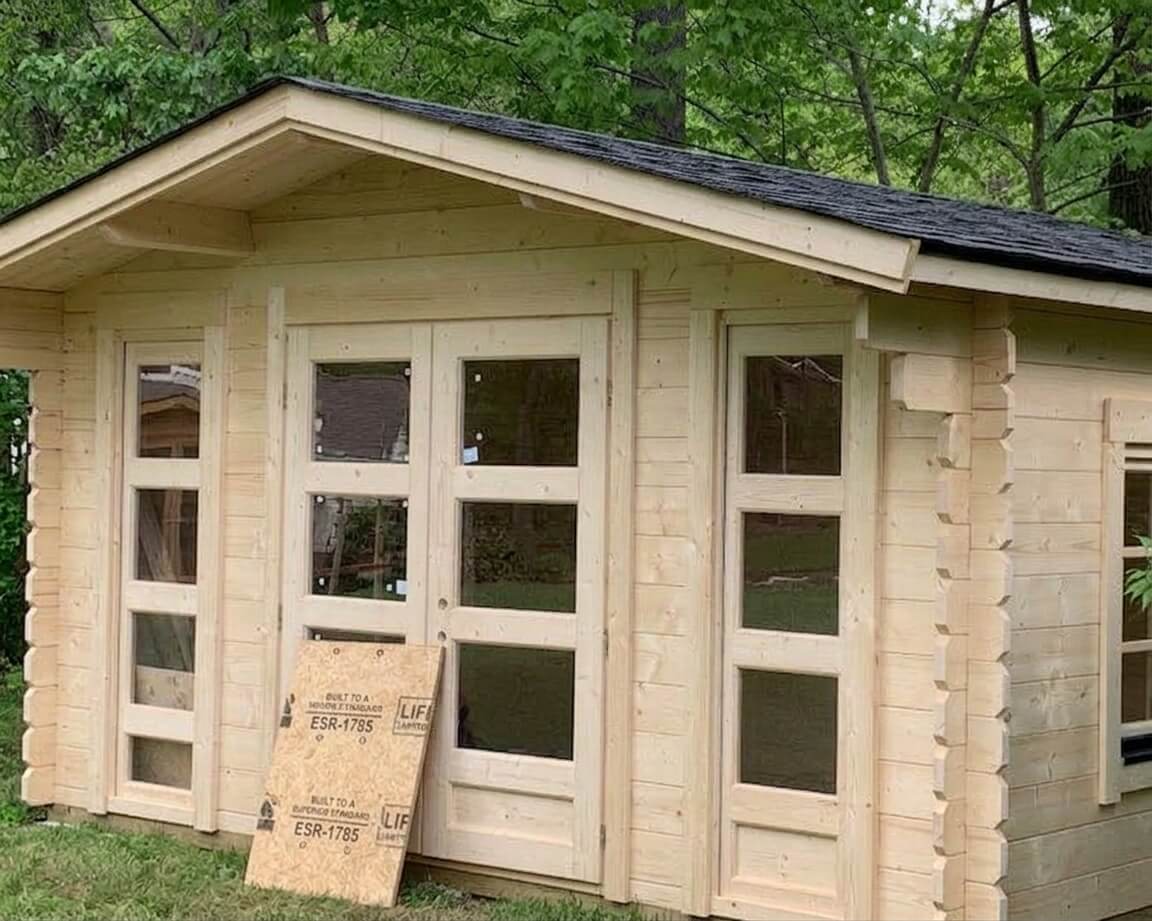 Finished dark-grey shingle roof on a Bristhol shed