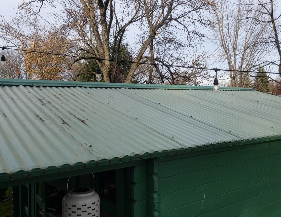 A green Bristhol shed with translucent green corrugated roof panels