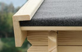 Corner of a SolidBuild roof with roll roofing wrapped over the edge of the boards