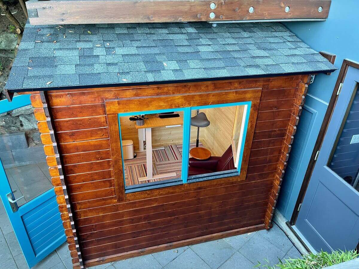 A Shiba shed seen from above with a grey-green asphalt-shingle roof