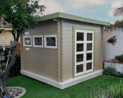 A stylishly painted Solidbuild Moderna garden shed retreat in an urban backyard
