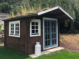 Whales wood garden shed with living roof