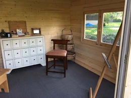 inside a backyard wood shed kit Bristhol art studio shed