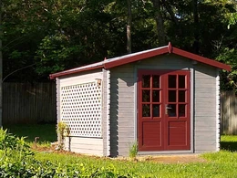 Gardener classic shed used as a potting shed featuring grey walls and birgundy doors and trim