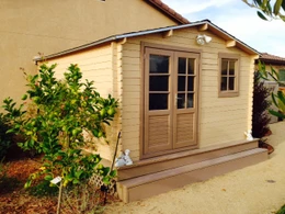Opima 12 x 12 storage shed painted brown