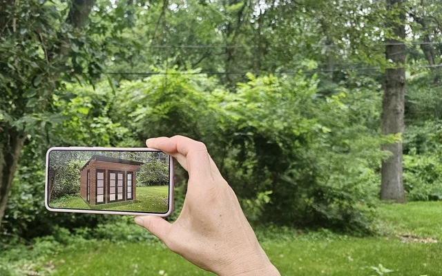 True-size preview: the California shed in natural spruce with peak height and outside depth measurements called out, next to a QR code panel reading Scan with your phone to place it in your yard at real size