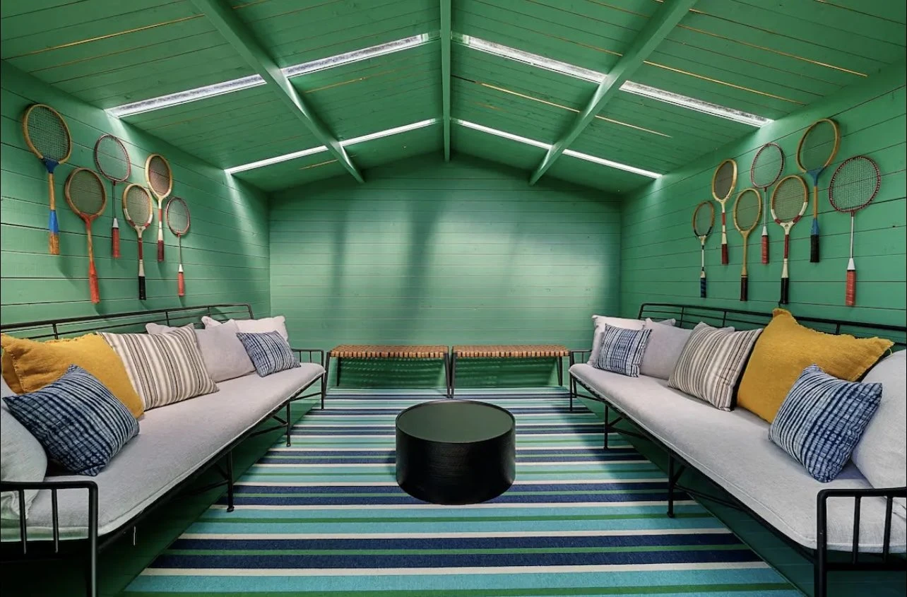 Vibrant green Bristhol interior styled as a lounge with a vaulted ceiling