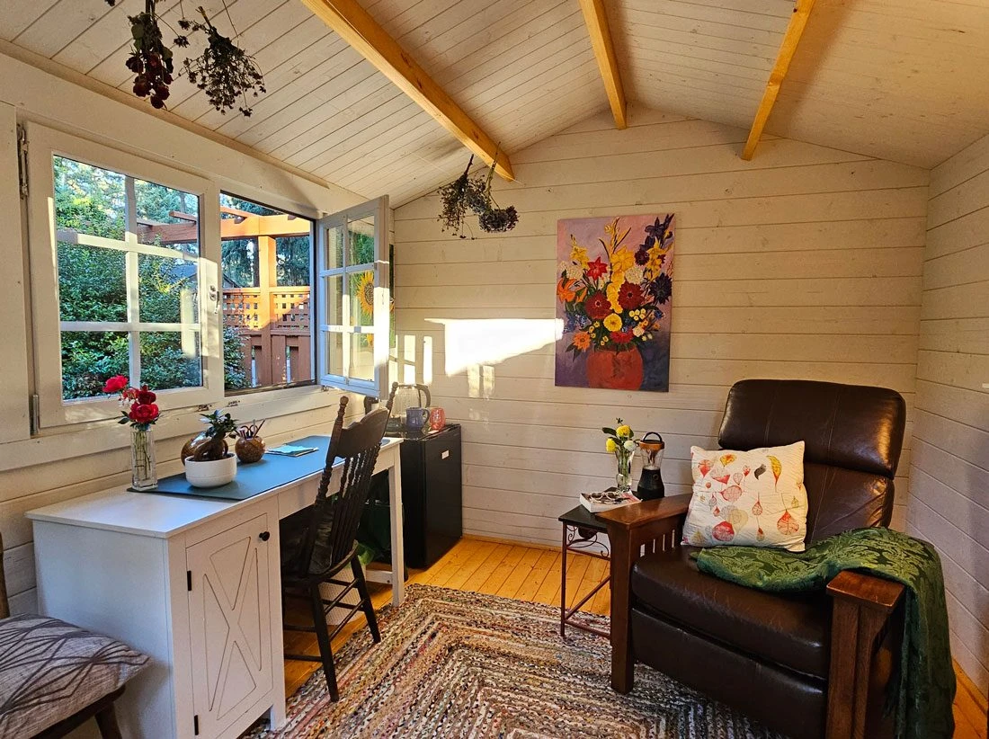 Shed interior styled as a personal studio in golden afternoon light