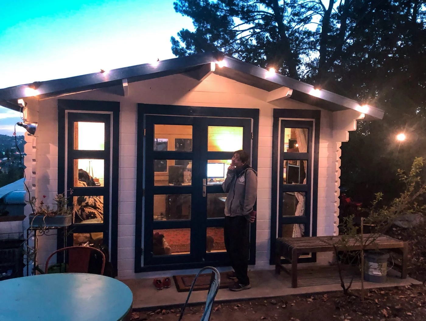 Bristhol garden shed strung with lights at dusk