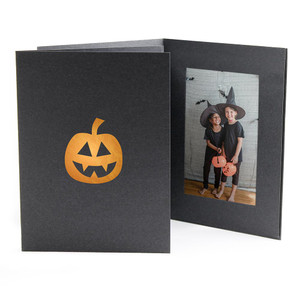 Black photo folder with copper foil Halloween pumpkin imprint on the front cover Black photo folder with copper foil Halloween pumpkin imprint on the front cover
