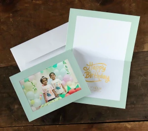 Mint green photo frame card with gold foil stamped birthday message inside
