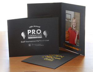 Custom 4x6 black photo folders with logo imprints in various foil colors