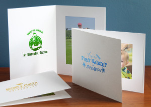 Custom white 4x6 photo folders with logo imprints in green, blue, and gold foils Custom white 4x6 photo folders with logo imprints in green, blue, and gold foils