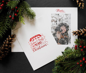 Custom festive and bright Christmas photo folder with red foil logo imprint and design Custom festive and bright Christmas photo folder with red foil logo imprint and design
