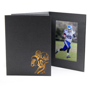 Vertical black photo folder with football player icon stamped in copper foil Vertical black photo folder with football player icon stamped in copper foil