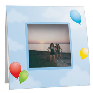 Colorful balloons against a blue sky with white clouds on a paper Polaroid frame Colorful balloons against a blue sky with white clouds on a paper Polaroid frame
