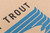 Kraft paper with close-up detail of printed blue and black logo Kraft paper with close-up detail of printed blue and black logo