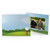 Golf course illustration with golf ball on tee against a blue sky with a few fluffy clouds. Photo folder for 4x6 pictures.