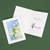 White photo insert card with printed sentiment and logo inside.