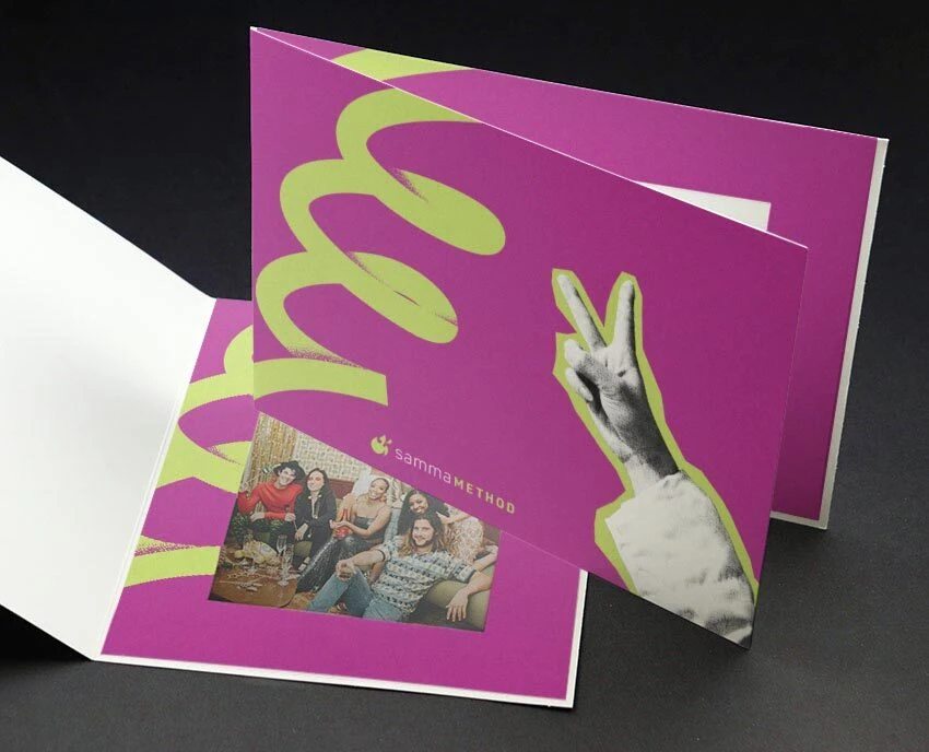 Purple photo folder with an image of someone showing a peace sign with their hand. A green scribble stands out across from the peace sign.