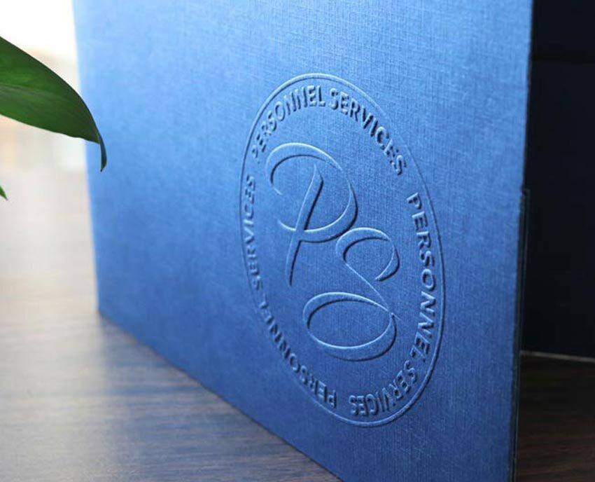 Blue pocket folder with embossed business logo