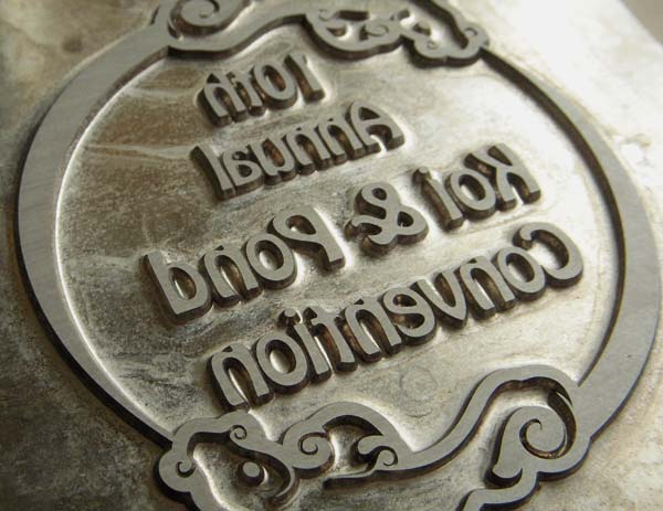 Metal plate used for foil stamping logos on photo folders