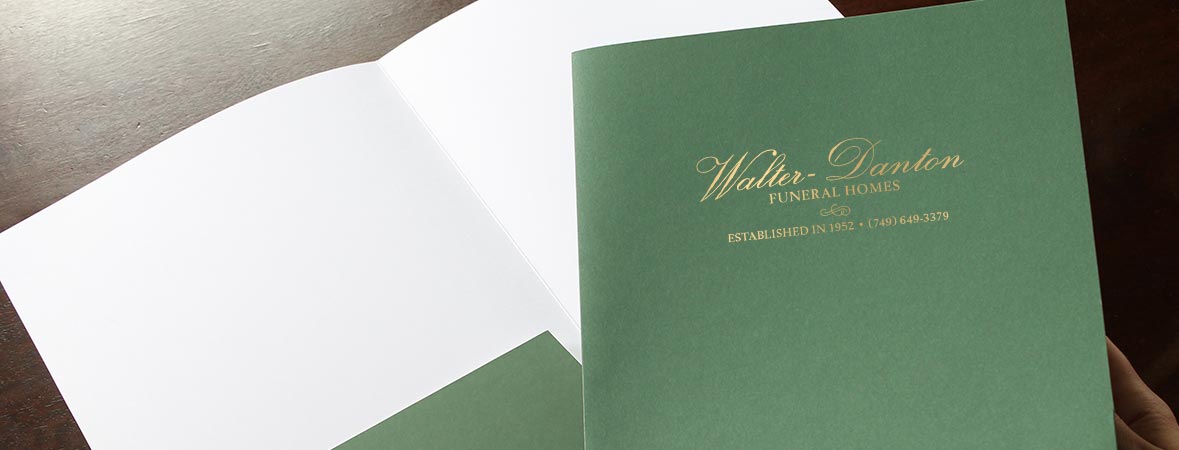 Green pocket folder with gold foil logo imprint for a funeral home.