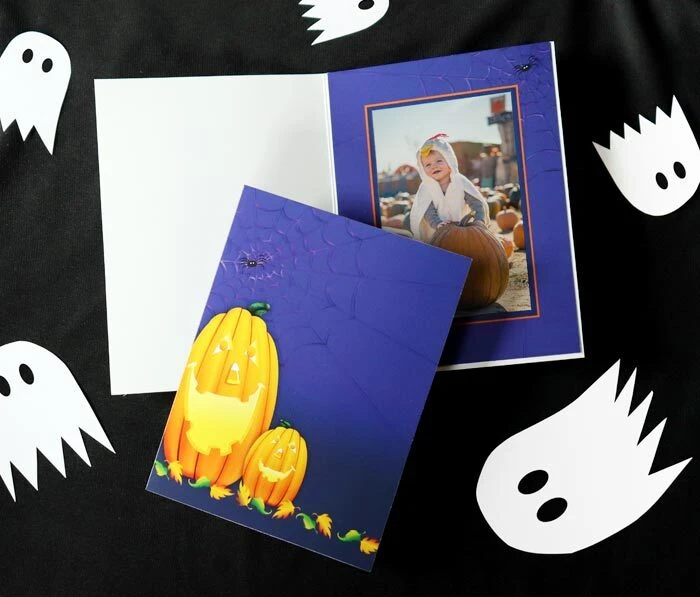 Halloween-themed photo folder with jack-o-lantern illustrated design