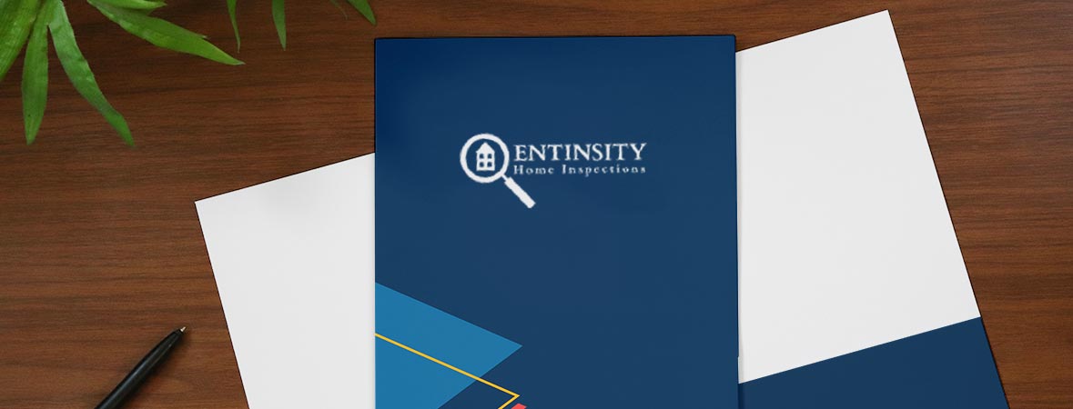 Custom home inspection pocket folder on a desk.