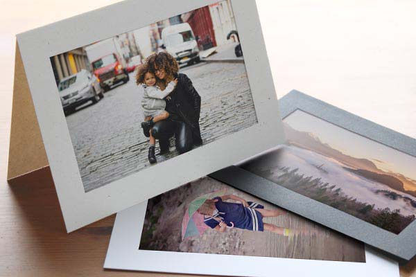 Three photo insert cards arranged on a table