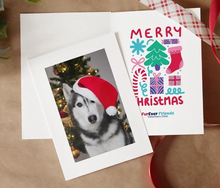 White photo insert card with a printed Christmas message inside.