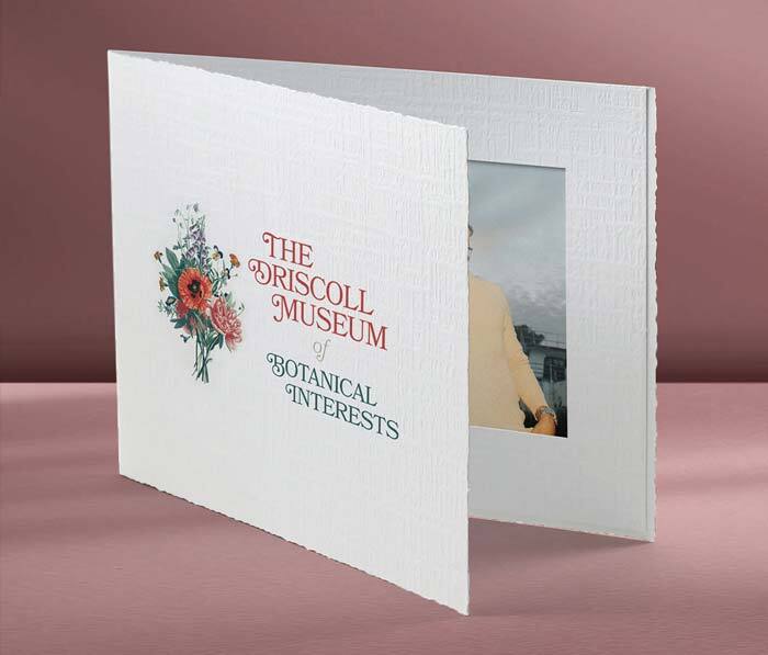White portrait folder with printed floral logo on the front cover