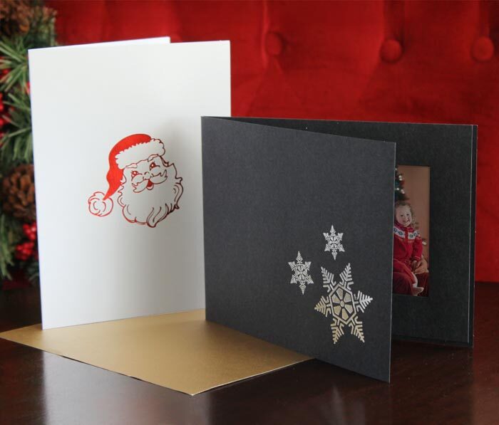 Santa and snowflake-themed Christmas photo folders
