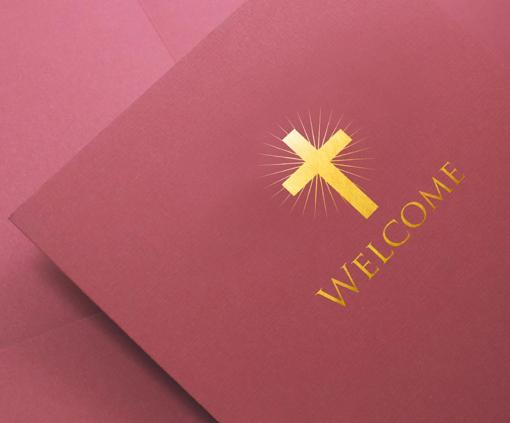 Burgundy church welcome folder with gold cross design