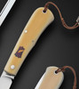 80%, F1 Shadow Folder with Westinghouse Ivorite Scales and Antique Amber Shield by Tom Ploppert
