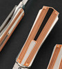 3/7 of Model: T-Rome, Folding California Dagger with Rose Gold and Antique Amber by Tore Fogarizzu