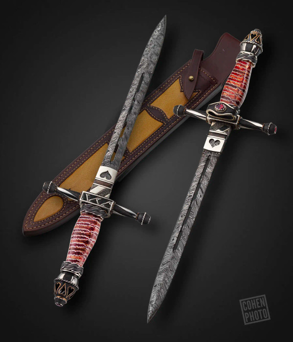 The Crimson Queen Dagger by Paul Jarvis, BLADE SHOW 2021 with Window Damascus, Collector Grade Fossilized Mammoth, Sterling Silver, Bronze Inlays and Rubies, A True Testament to Artistry and Heritage The Crimson Queen Dagger by Paul Jarvis, BLADE SHOW 2021 with Window Damascus, Collector Grade Fossilized Mammoth, Sterling Silver, Bronze Inlays and Rubies, A True Testament to Artistry and Heritage