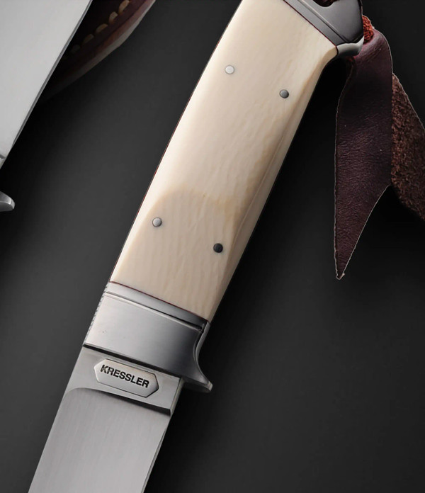 Integral Hunter with Antique Mammoth, 8.75" OA, by Dietmar Kressler. Integral Hunter with Antique Mammoth, 8.75" OA, by Dietmar Kressler.