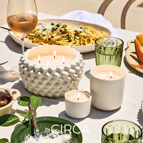 Image of a Circa Home's elegant alchemy white candles on a dining table setting