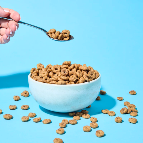 Low Carb Emporium Protein Cereal Cinnamon Flavour 250g content in a bowl with spoon