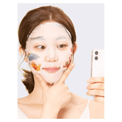 Person using JMsolution Selfie Barrier Calendula Mask on face